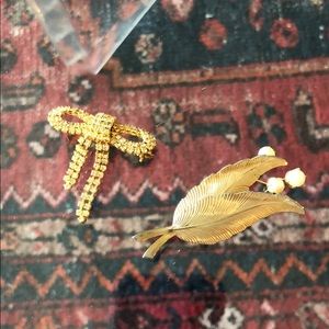 Two gold brooches